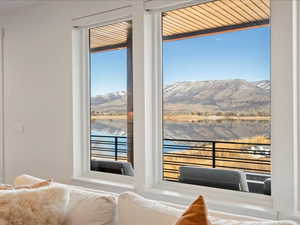 Bedroom featuring a water and mountain view