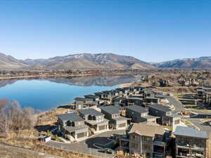 Aerial view of residential area featuring a water and mountain view