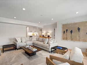 Living area with recessed lighting and wood finished floors