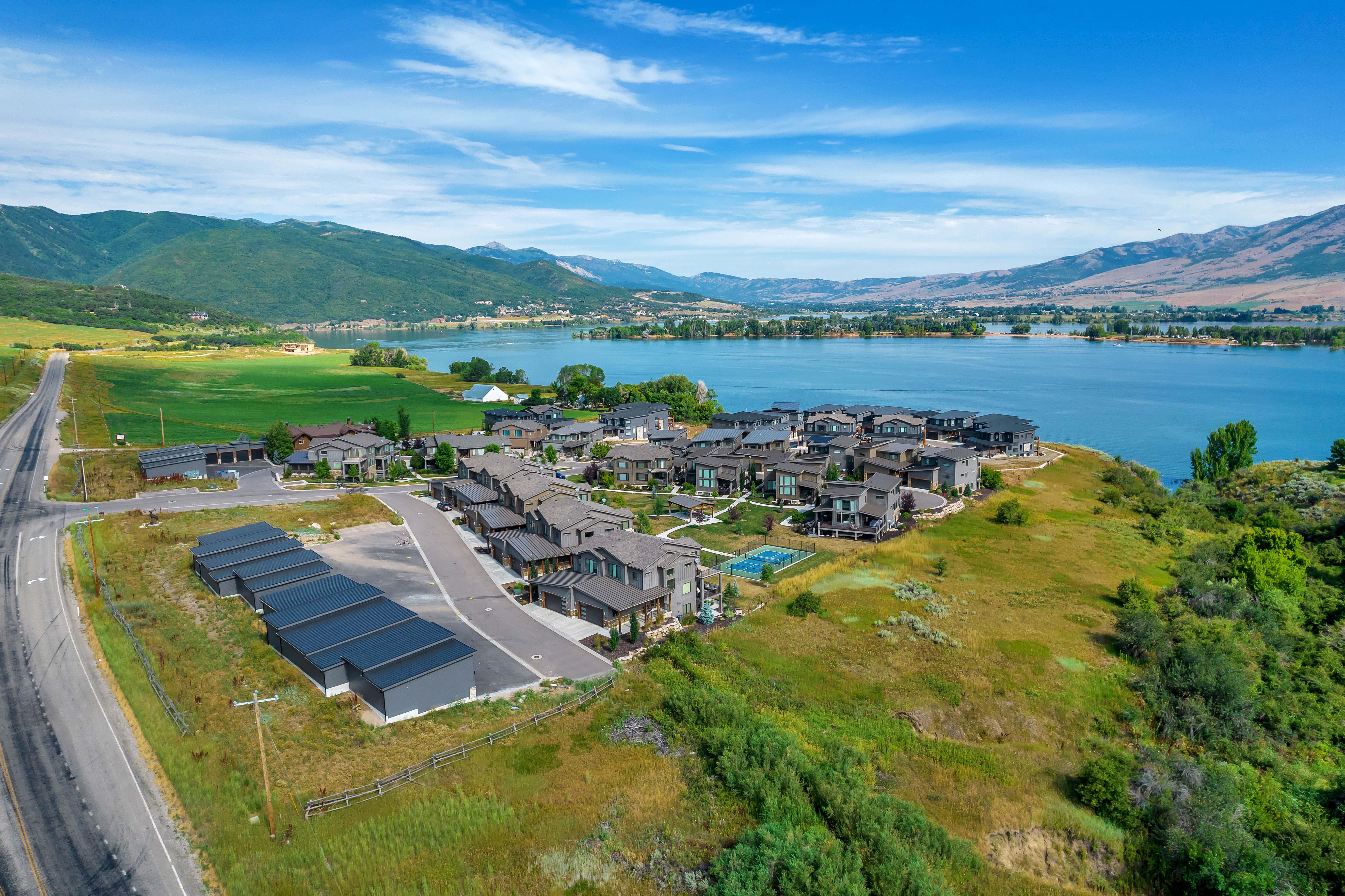 Aerial perspective of suburban area with a water and mountain view