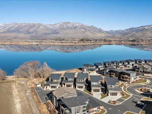 Aerial view of residential area featuring a water and mountain view