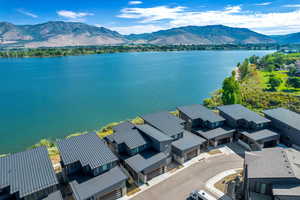 Aerial view of residential area featuring a water and mountain view