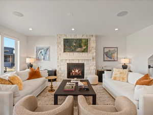 Living area with a fireplace and recessed lighting