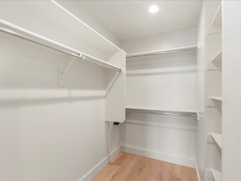 Walk in closet featuring light wood-type flooring