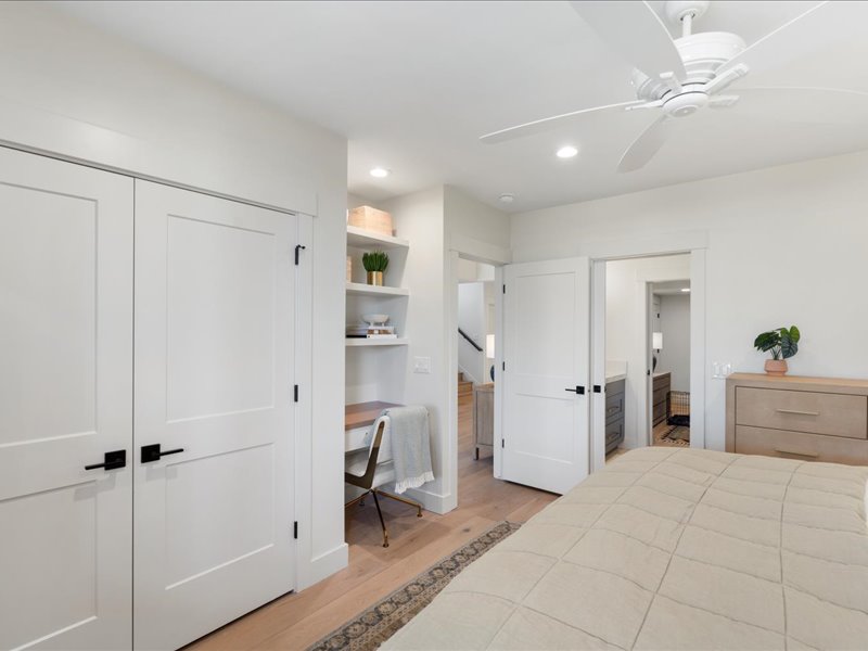 Bedroom with built in desk, light wood-style flooring, a closet, ceiling fan, and recessed lighting
