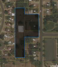 Aerial overview of property's location with property parcel outlined