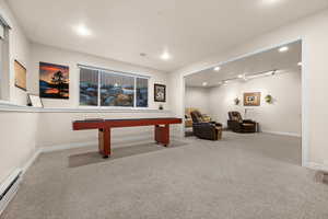 Recreation room with baseboard heating, light carpet, recessed lighting, and pool table