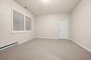 Unfurnished room featuring light colored carpet and baseboards