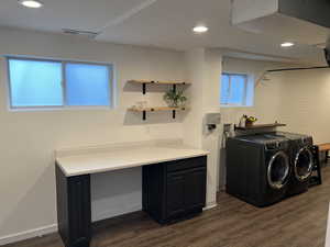 Laundry area featuring washer and dryer, recessed lighting, and dark wood-style floors