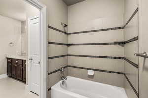Bathroom with  shower combination, vanity, and light tile patterned floors