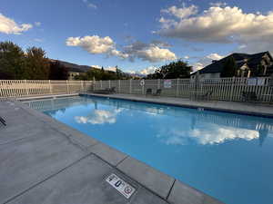 Community pool featuring a patio area and a mountain view