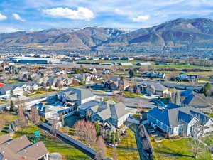 Aerial perspective of backyard and community featuring mountains