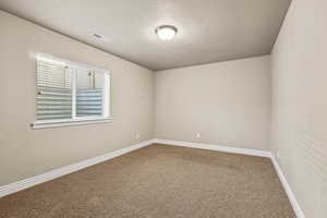 Spare room with carpet flooring and baseboards