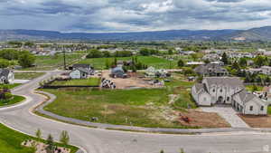 Aerial view of residential area featuring a mountainous background