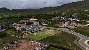 View of property location with a mountainous background and nearby suburban area