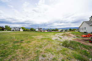View of yard with a rural view