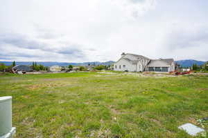 View of yard with a mountain view and a view of countryside