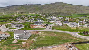 View of property location with nearby suburban area and a mountainous background