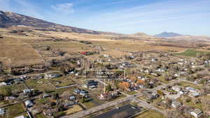 Aerial view of property's location with mountains and rural landscape