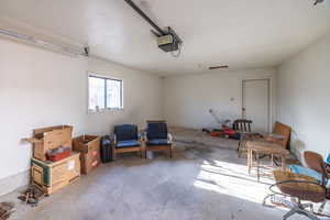 Garage featuring a garage door opener