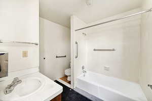Bathroom featuring vanity and tub / shower combination
