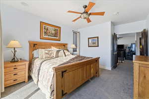 Primary Bedroom w/ 8' sliding glass doors to oversized deck, Updated En-Suite bathroom and walk in closet.