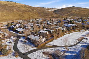 Exterior of back of house showing trails and Mountain Views