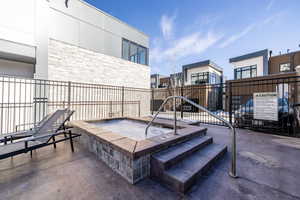 View of patio featuring a hot tub