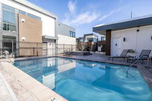 Community pool with a patio