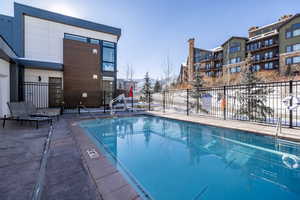 Community pool with a patio area