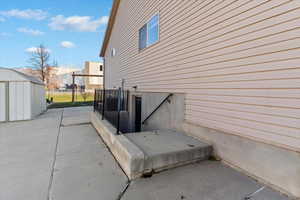 View of patio featuring an outdoor structure