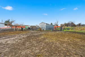 View of yard with an outbuilding, a pole building, and a view of countryside