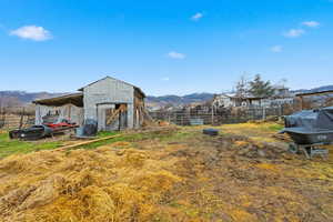 View of yard with an outbuilding and a mountain view