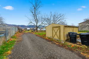 View of dirt / gravel road featuring a mountain view