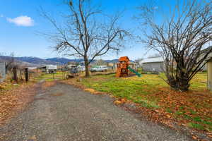 View of yard featuring a playground