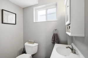 Half bath with toilet and vanity