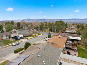 Aerial view of residential area featuring a mountain backdrop
