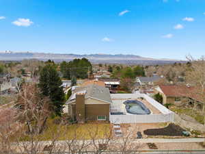 Aerial view of residential area featuring mountains