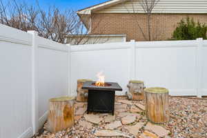 View of patio featuring a fire pit