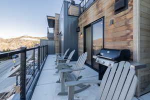 Balcony featuring area for grilling