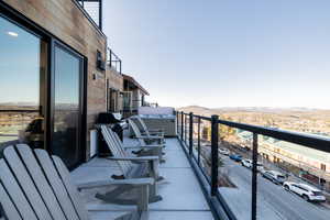 Balcony featuring area for grilling and a mountain view