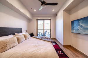 Bedroom featuring light wood-style flooring, access to outside, ceiling fan, and recessed lighting