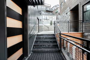 Stairs featuring wooden walls