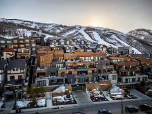 Snowy aerial view featuring a mountain view