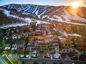 Snowy aerial view featuring a mountain view