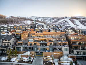 Snowy aerial view featuring a mountain view