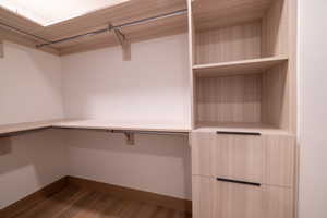 Walk in closet featuring light wood-style floors