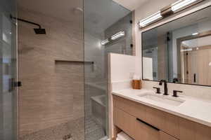 Full bathroom with vanity and walk in shower