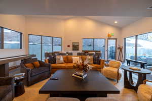 Living room featuring recessed lighting and high vaulted ceiling