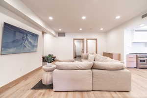 Living room featuring recessed lighting and light wood-style floors